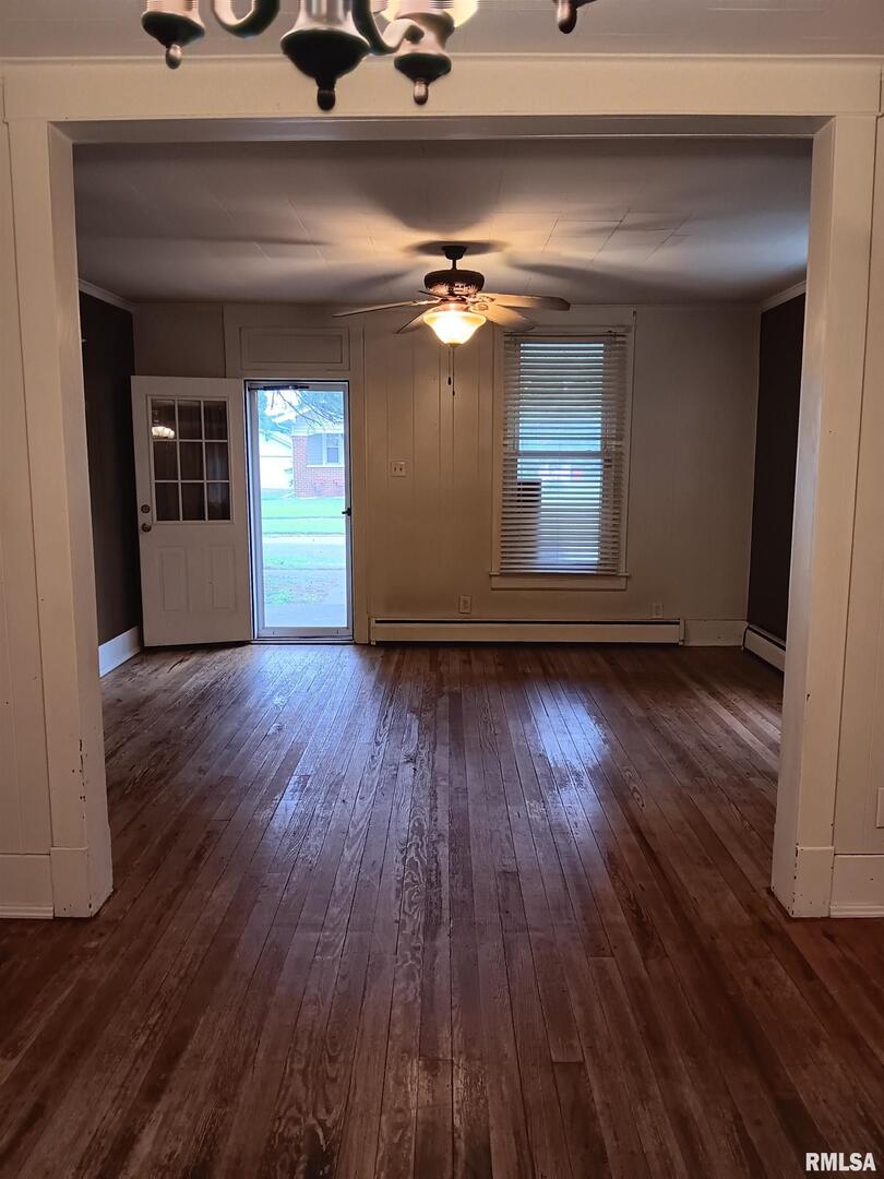 1935 Elm Street Murphysboro, IL 62966 - Photo 7 of 23 a view of a room with wooden floor and a ceiling fan