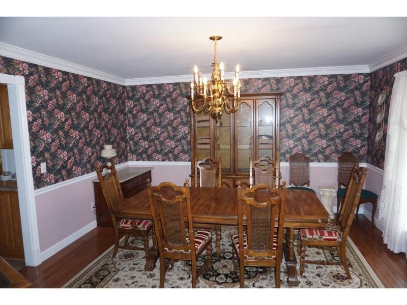2384 Rocky Fork Road Nolensville, TN 37135 - Photo 11 of 21 a view of a dining room with furniture and chandelier