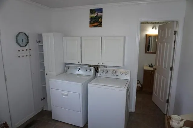 a bed room with a bed and a chair