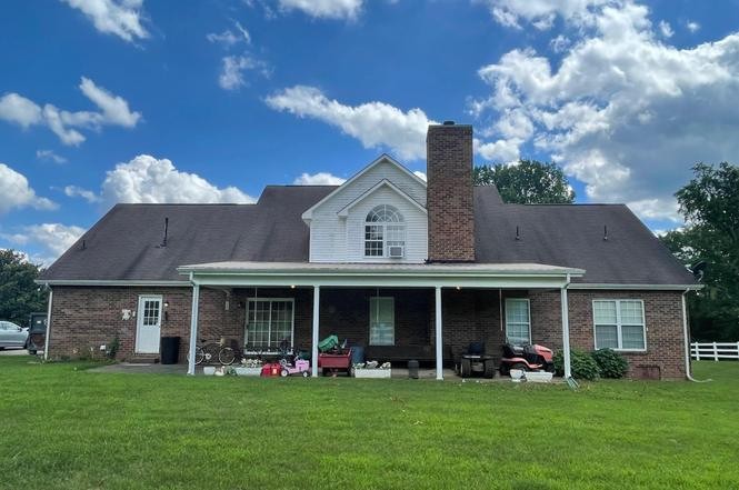 2384 Rocky Fork Road Nolensville, TN 37135 - Photo 19 of 21 a front view of a house with a garden and porch