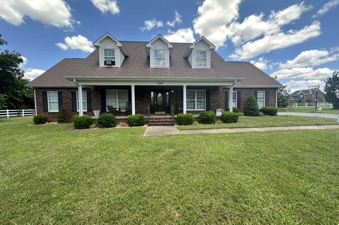 2384 Rocky Fork Road Nolensville, TN 37135 - Photo 2 of 21 a front view of a house with garden and plants