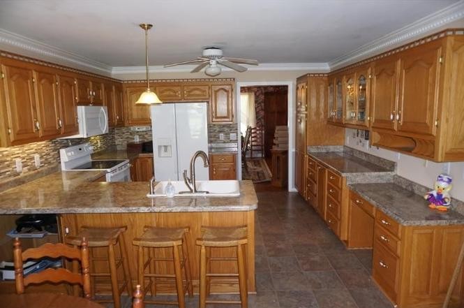 2384 Rocky Fork Road Nolensville, TN 37135 - Photo 5 of 21 a kitchen with stainless steel appliances granite countertop a sink and cabinets