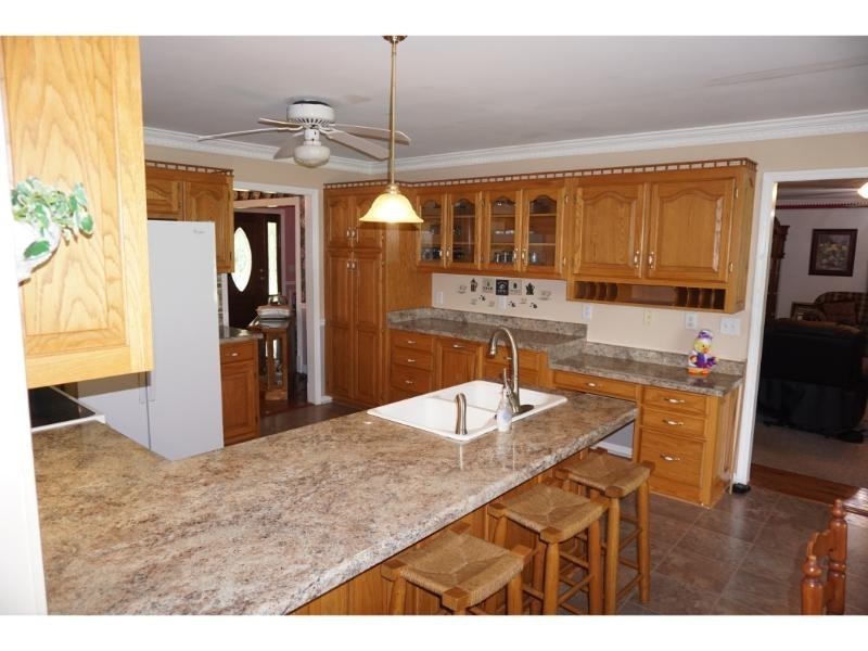 2384 Rocky Fork Road Nolensville, TN 37135 - Photo 6 of 21 a kitchen with stainless steel appliances granite countertop a sink and a refrigerator