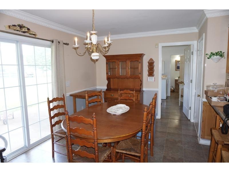 2384 Rocky Fork Road Nolensville, TN 37135 - Photo 8 of 21 a view of a dining room with furniture and wooden floor