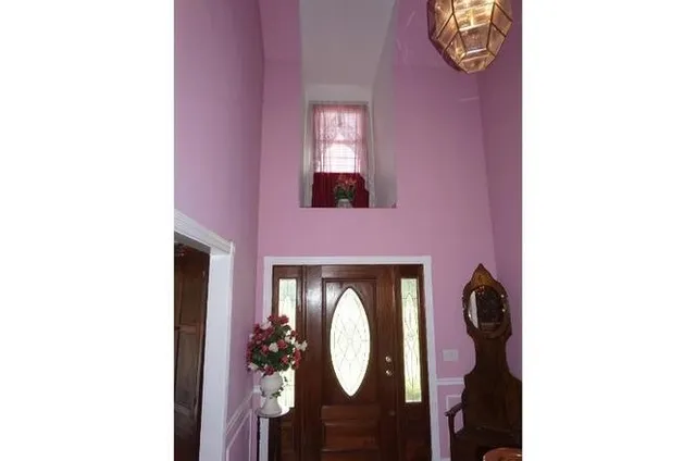 a view of entryway with wooden floor