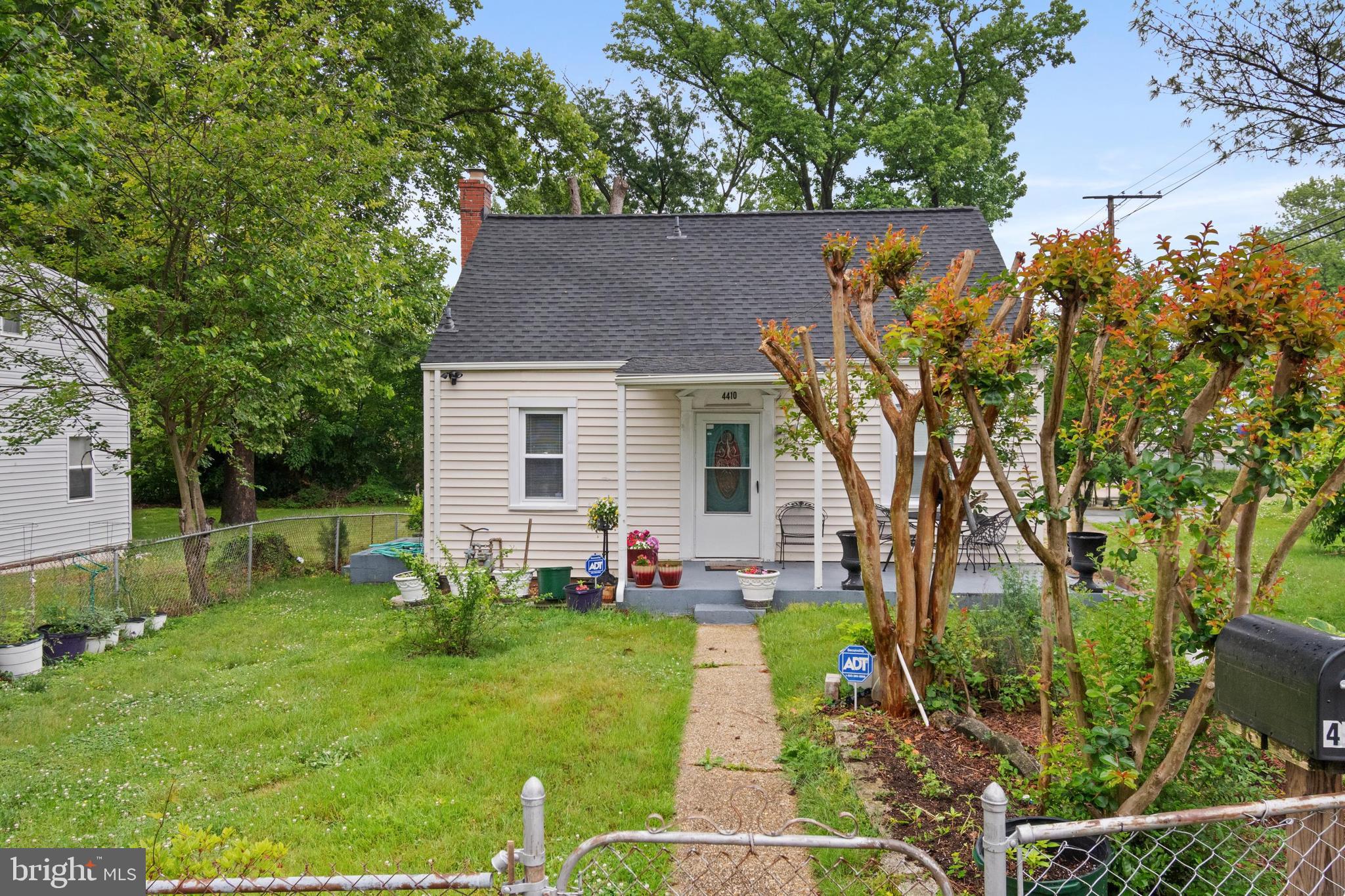 4410 Allies Road Suitland, MD 20746 - Photo 27 of 30 a view of backyard of house with outdoor seating and green space