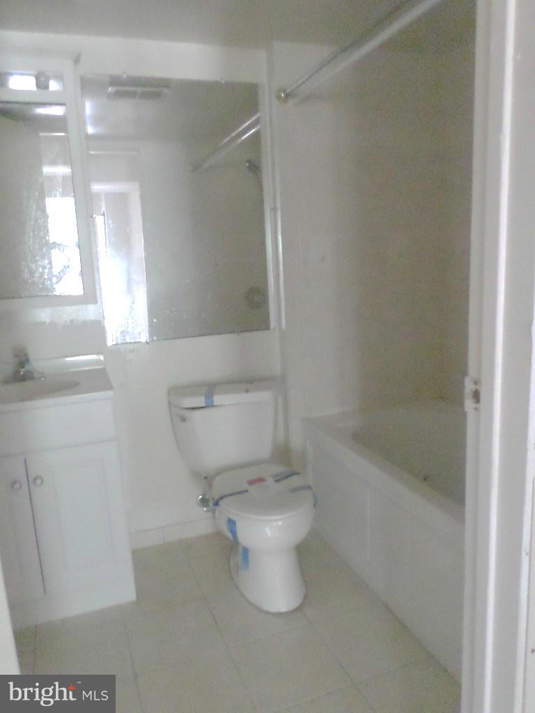 8504 Ritchboro Road District Heights, MD 20747 - Photo 4 of 7 a bathroom with a toilet and a shower