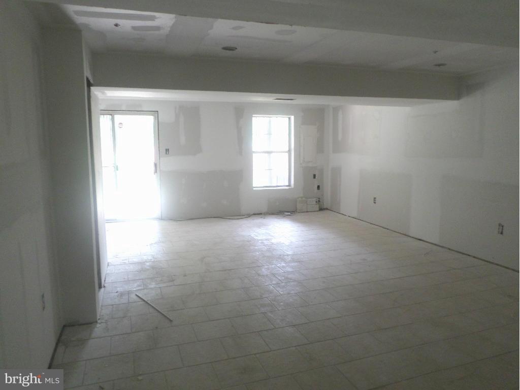 8504 Ritchboro Road District Heights, MD 20747 - Photo 5 of 7 a view of empty room with windows