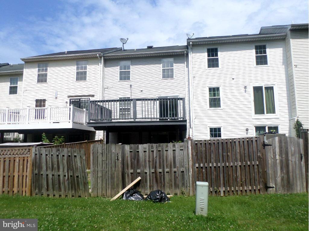 8504 Ritchboro Road District Heights, MD 20747 - Photo 6 of 7 a view of a house with wooden fence and a stairs