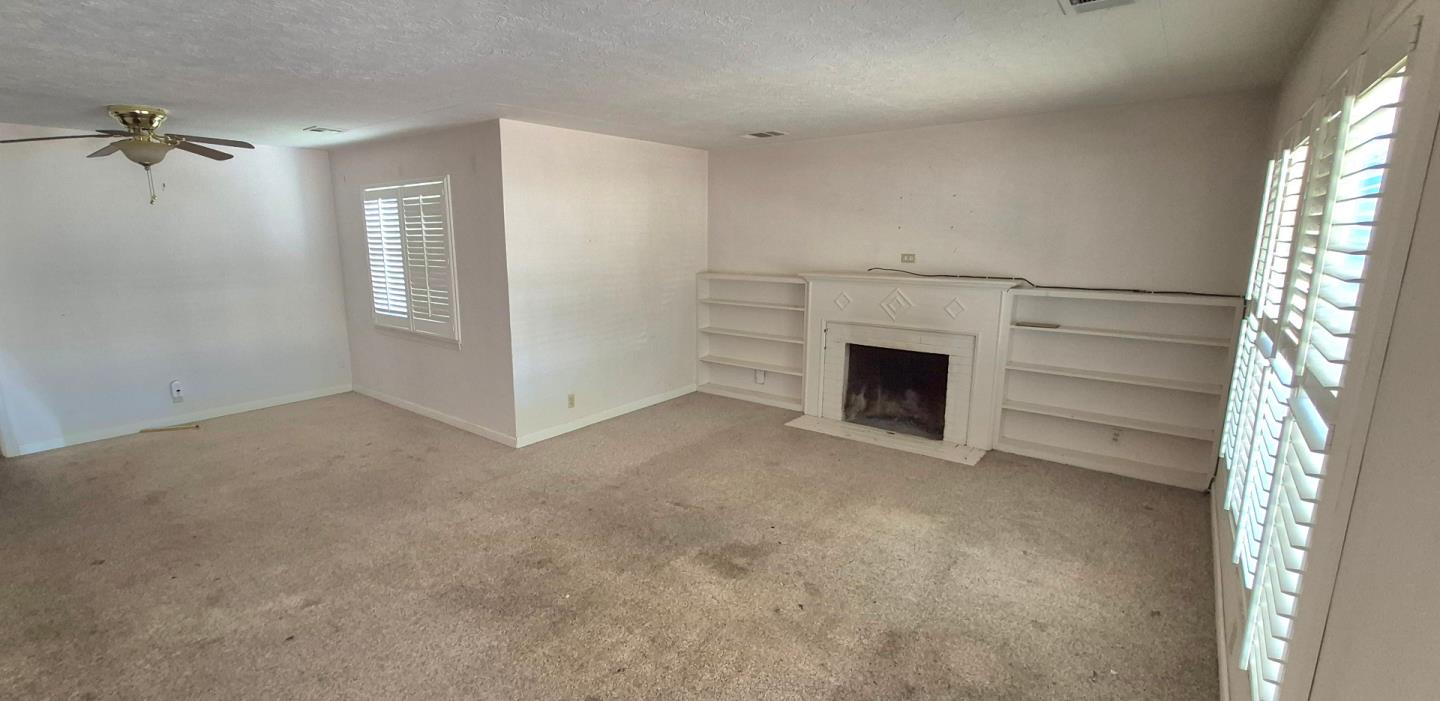 1032 9th Street Los Banos, CA 93635 - Photo 2 of 12 a view of empty room with fireplace