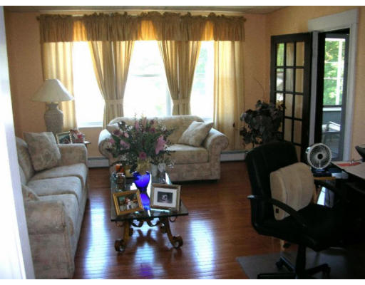 30-32 Exeter Street Lawrence, MA 01843 - Photo 3 of 8 a living room with furniture and a large window