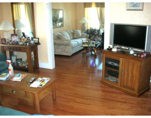 30-32 Exeter Street Lawrence, MA 01843 - Photo 4 of 8 a living room with furniture and a flat screen tv