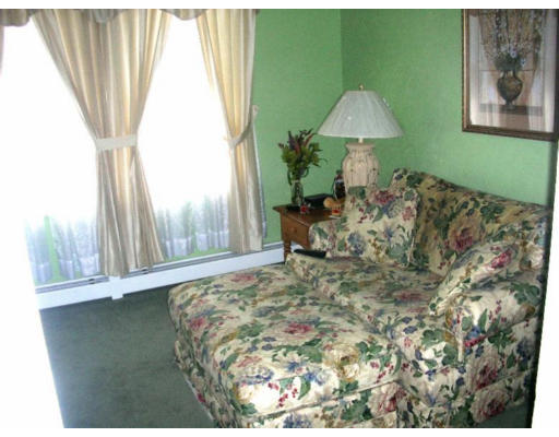 30-32 Exeter Street Lawrence, MA 01843 - Photo 6 of 8 a bed room with a bed and a chair