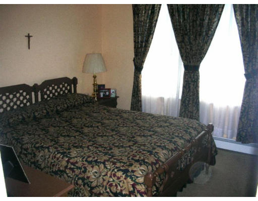 30-32 Exeter Street Lawrence, MA 01843 - Photo 8 of 8 a bedroom with a bed dresser and a window