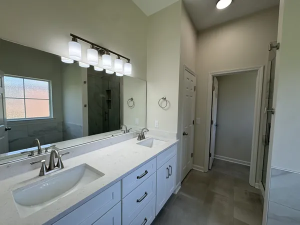 a bathroom with a glass shower door