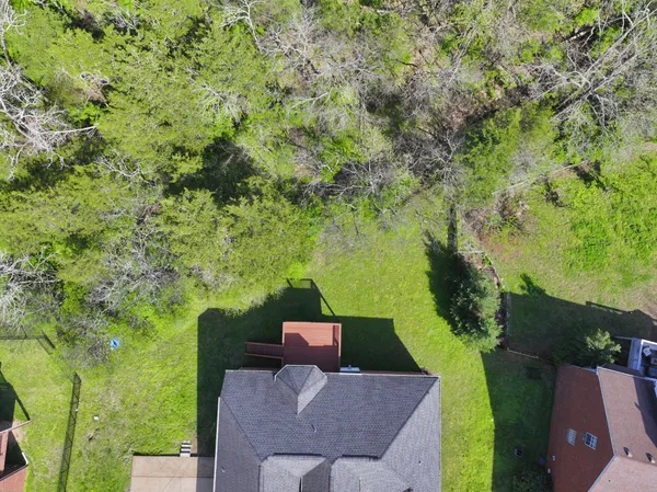 an aerial view of a house with a garden