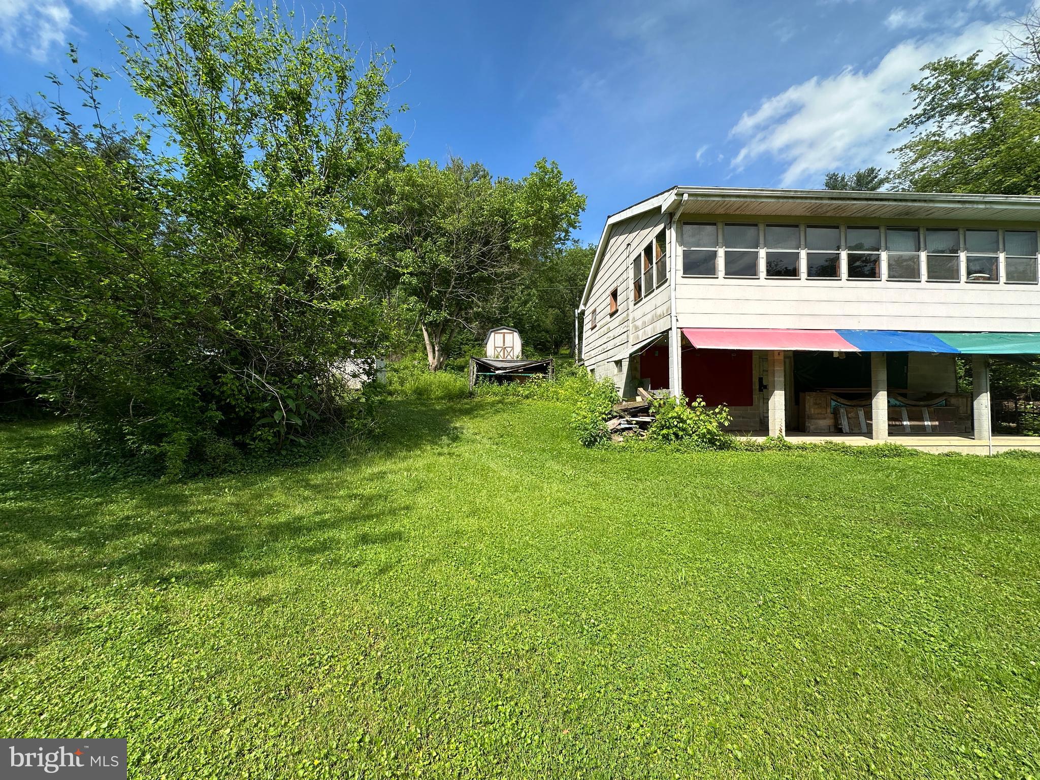 13726 Hopps Landing Road Hagerstown, MD 21740 - Photo 40 of 71 a front view of a house with a yard table and chairs