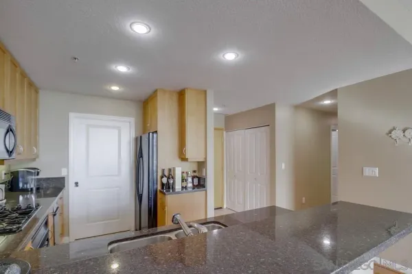 a view of a hallway with dining area