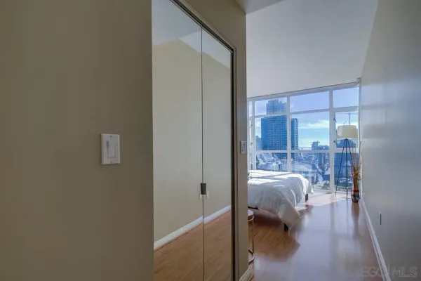 a bed room with a bed and a balcony