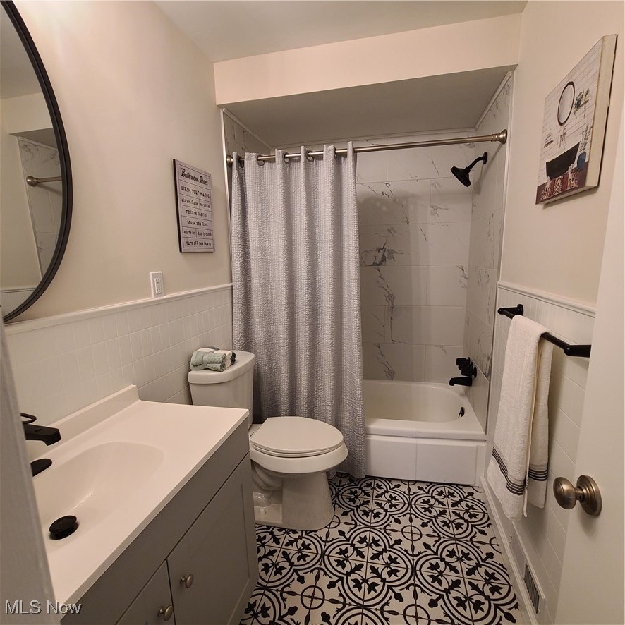 12204 Grannis Road Garfield Heights, OH 44125 - Photo 7 of 22 main bathroom has updated flooring and modern fixtures