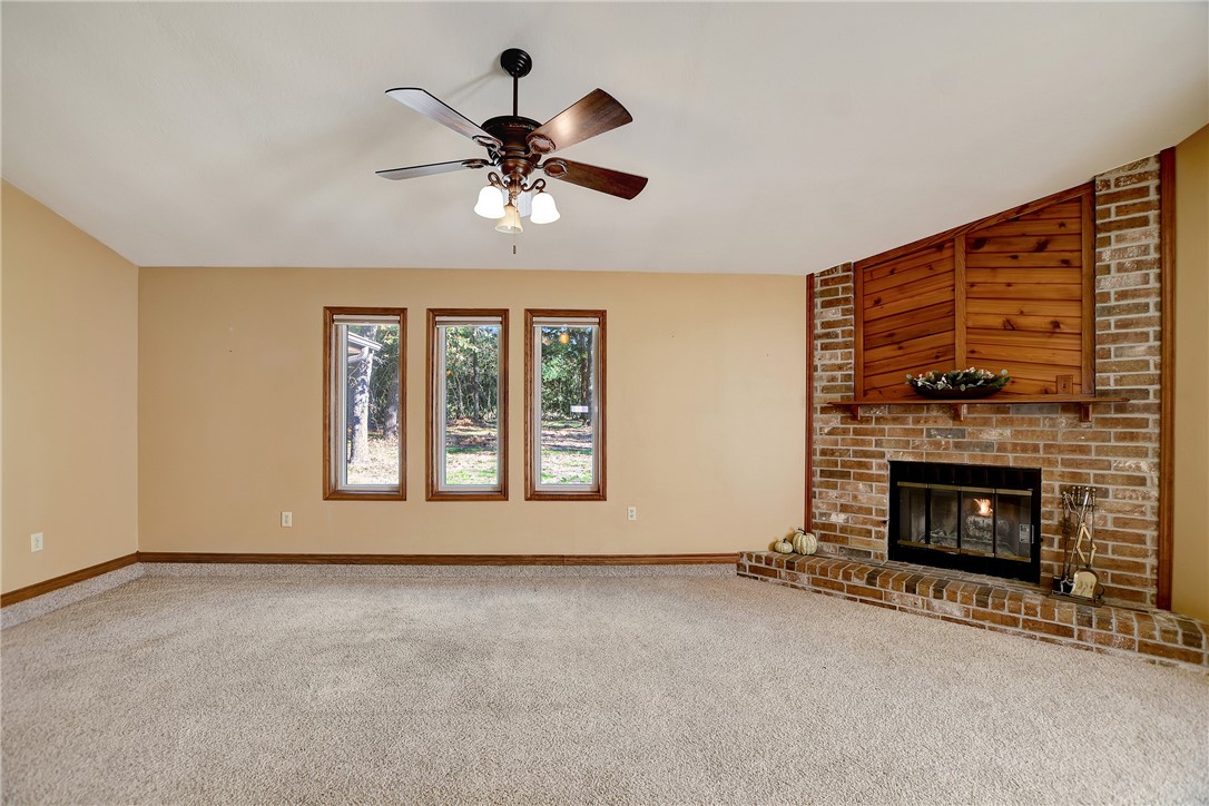 8846 Jackrabbit Lane Bryan, TX 77808 - Photo 11 of 48 a view of an empty room with a fireplace and window