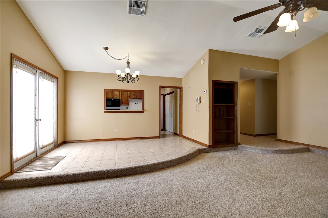 8846 Jackrabbit Lane Bryan, TX 77808 - Photo 13 of 48 an empty room with a windows and ceiling fan