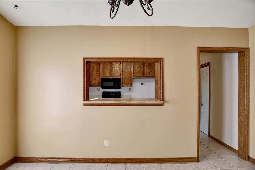 8846 Jackrabbit Lane Bryan, TX 77808 - Photo 20 of 48 a view of a hallway with wooden floor and a cabinet
