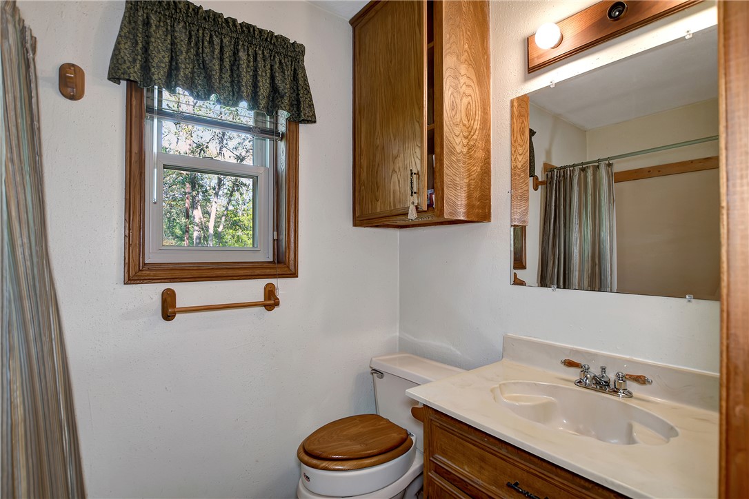 8846 Jackrabbit Lane Bryan, TX 77808 - Photo 36 of 48 a bathroom with a sink a toilet and shower