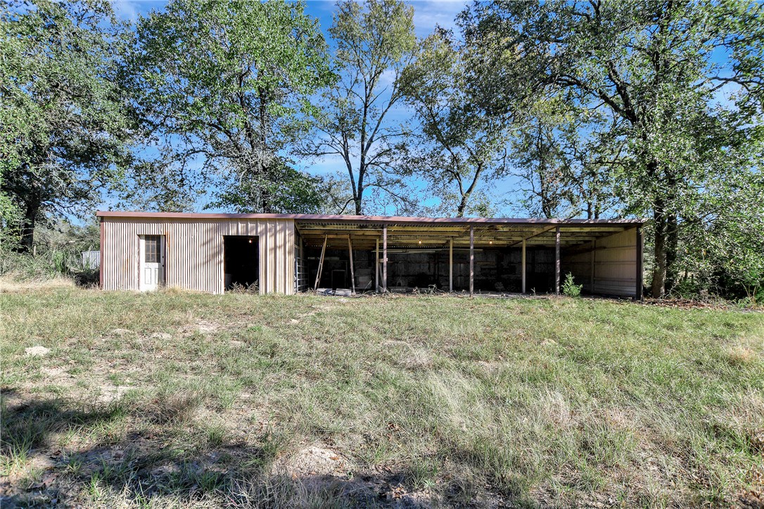 8846 Jackrabbit Lane Bryan, TX 77808 - Photo 41 of 48 a view of a house with a yard and large tree