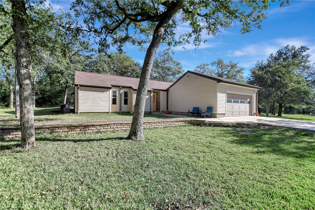 8846 Jackrabbit Lane Bryan, TX 77808 - Photo 6 of 48 a house view with a garden space