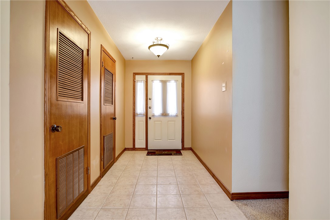 8846 Jackrabbit Lane Bryan, TX 77808 - Photo 8 of 48 a view of a hallway with wooden shelves