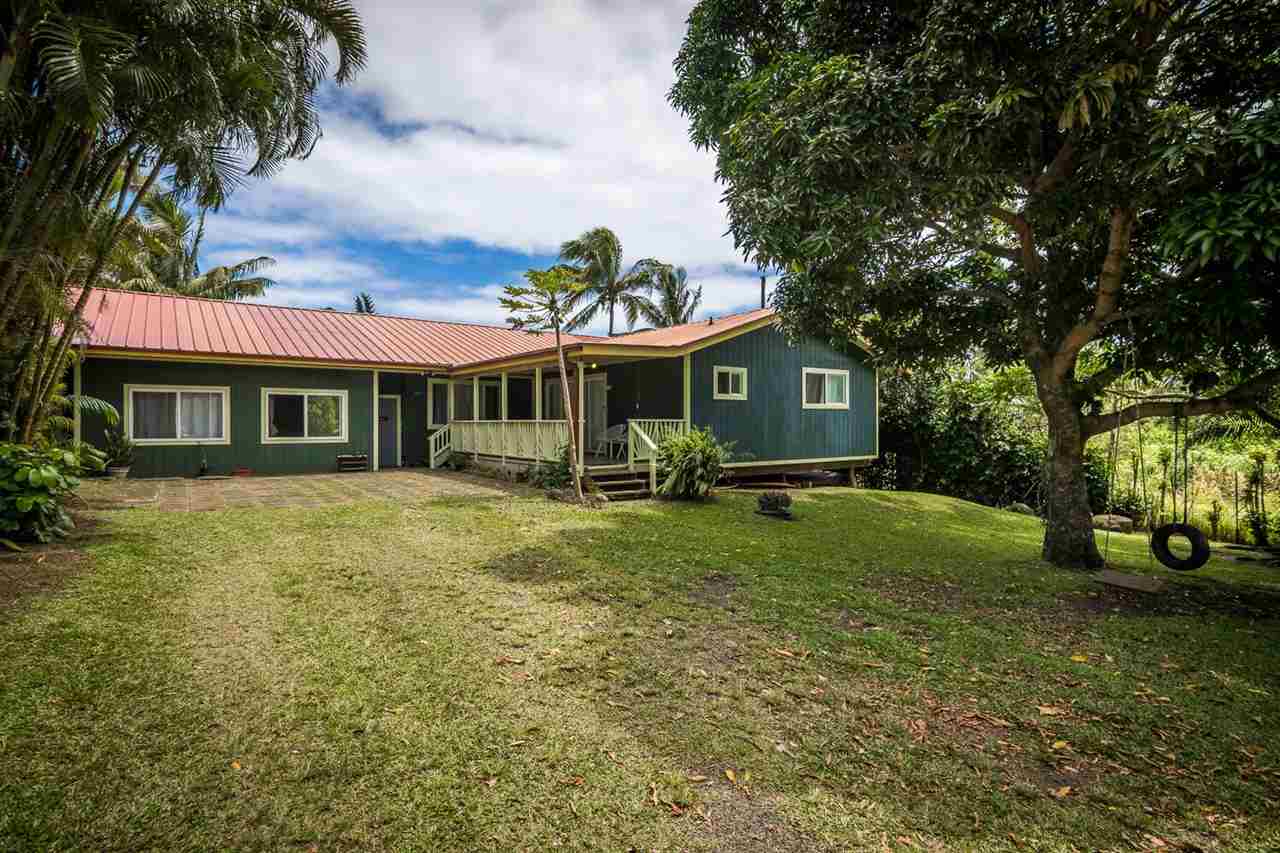 34 Door Of Faith Road Haiku, HI 96708 - Photo 1 of 8 a front view of a house with garden
