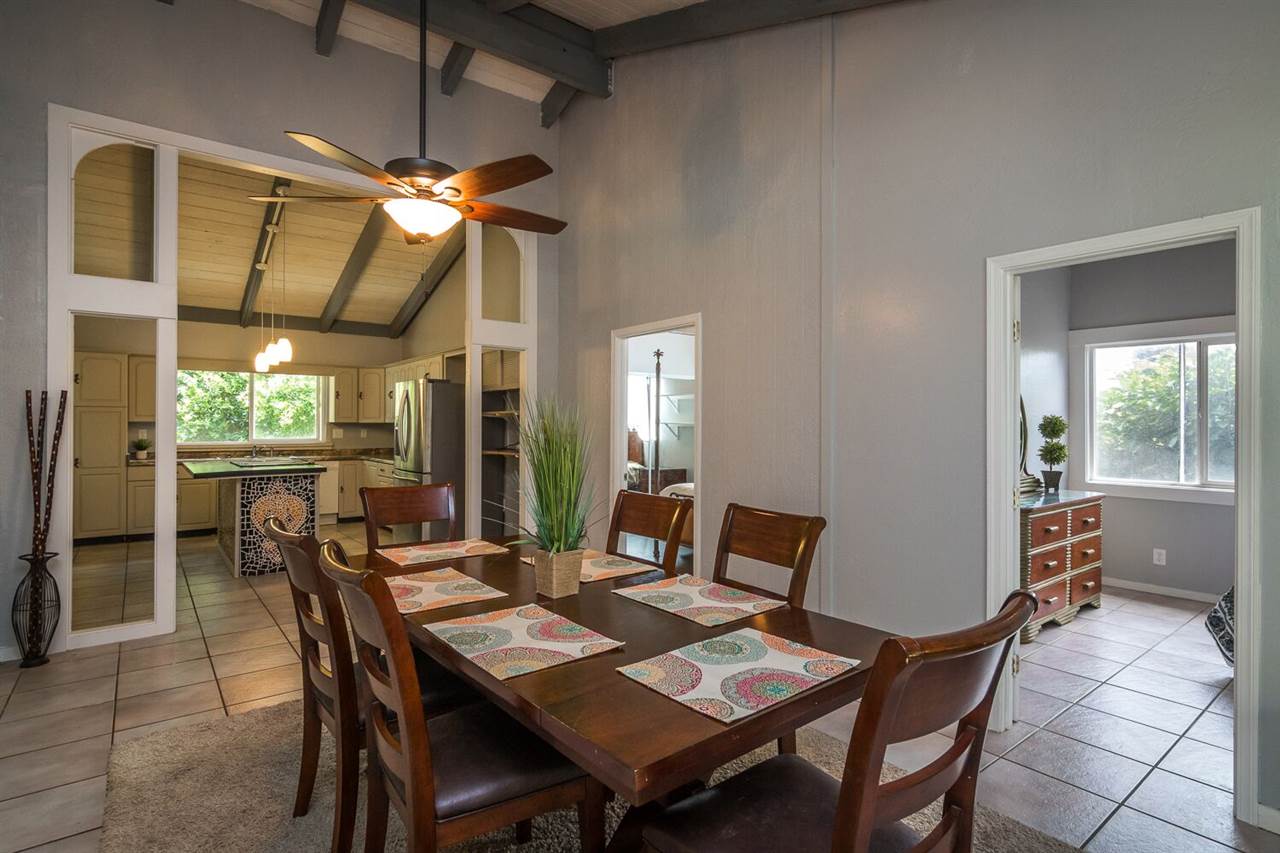34 Door Of Faith Road Haiku, HI 96708 - Photo 3 of 8 a dining room with furniture a chandelier and window