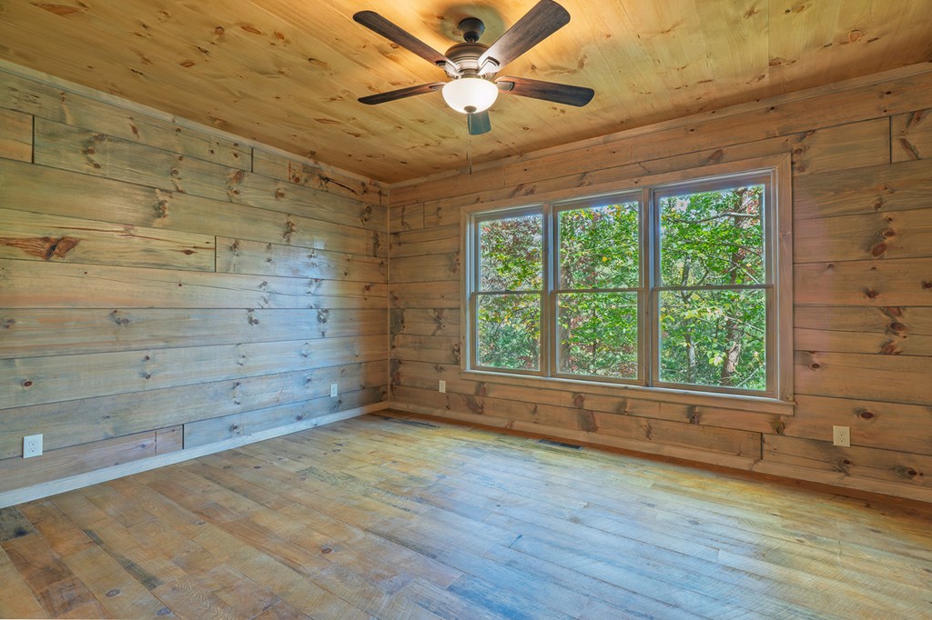 85 Moreland Trail Blue Ridge, GA 30513 - Photo 12 of 56 wooden floor in an empty room with a window