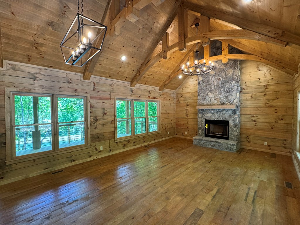 85 Moreland Trail Blue Ridge, GA 30513 - Photo 33 of 56 a view of an empty room with a fireplace and a window