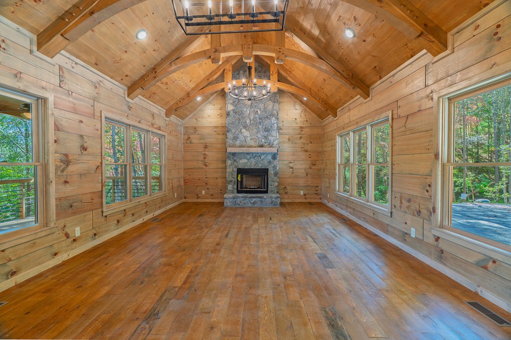 85 Moreland Trail Blue Ridge, GA 30513 - Photo 4 of 56 a view of an empty room with wooden floor and a window