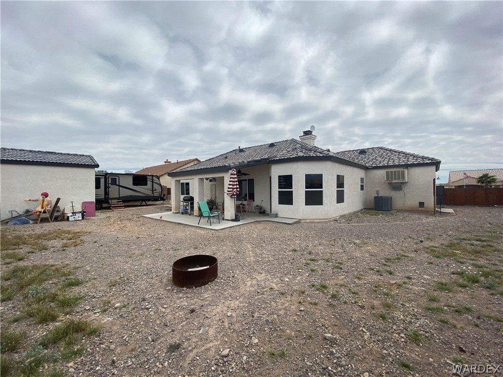2111 Jamie Road Fort Mohave, AZ 86426 - Photo 41 of 50 a front view of a house with yard and car parked
