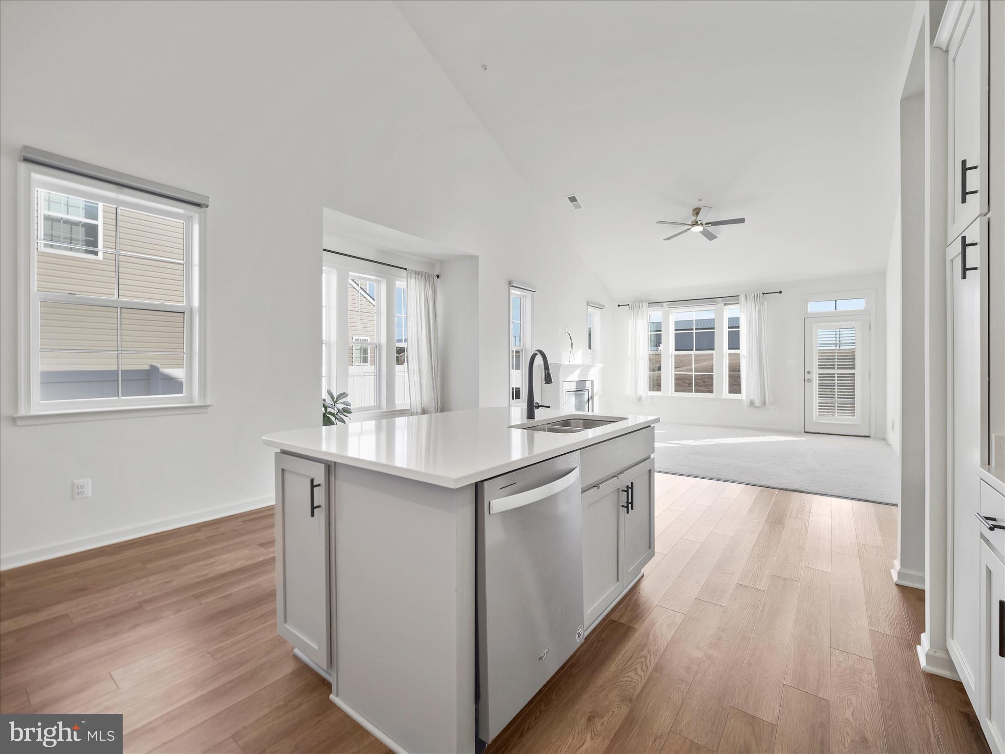 10227 Rashti Court Hagerstown, MD 21740 - Photo 14 of 36 a kitchen with stainless steel appliances granite countertop a sink stove and wooden floor