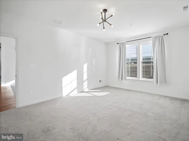 a view of empty room with windows