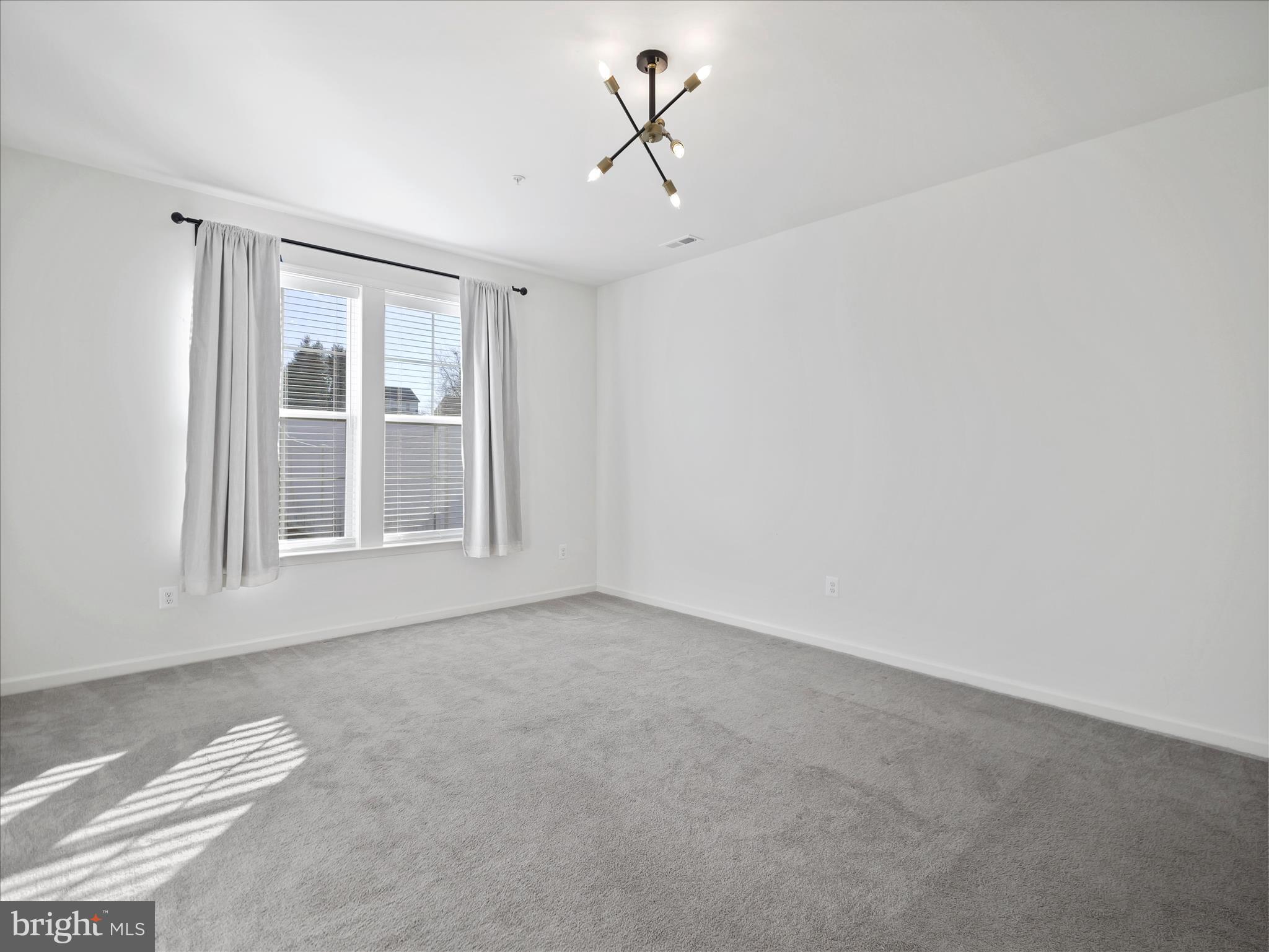 10227 Rashti Court Hagerstown, MD 21740 - Photo 19 of 36 a view of a livingroom with a ceiling fan and window