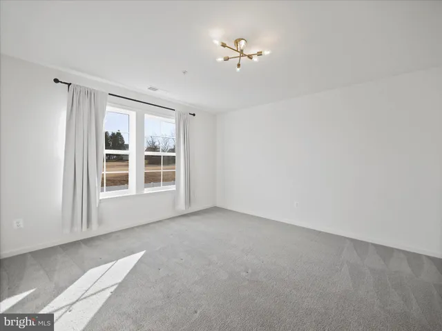 a view of empty room with windows