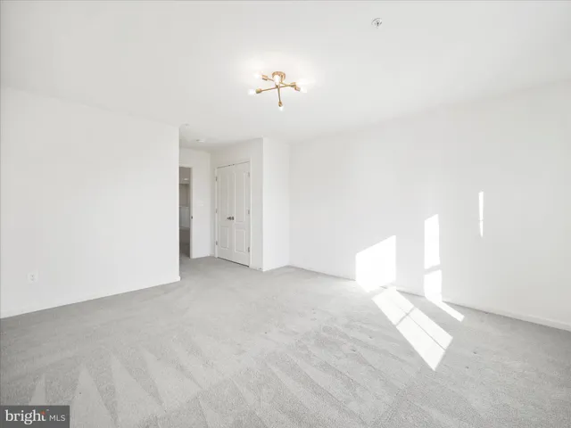 a view of a big room with carpet