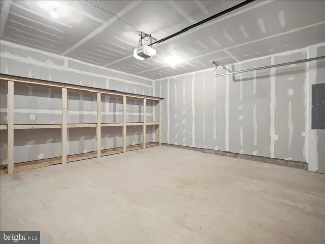 an empty room with a empty space and windows