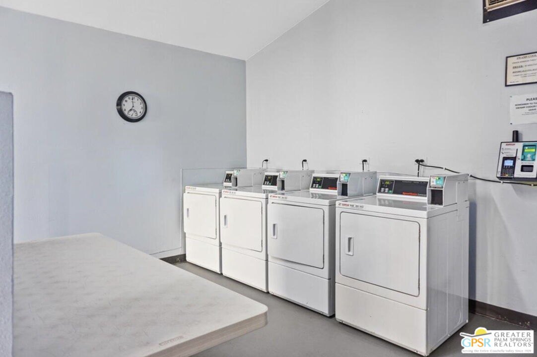 1421 North Sunrise Way, Unit 34 Palm Springs, CA 92262 - Photo 33 of 34 a utility room with dryer and washer
