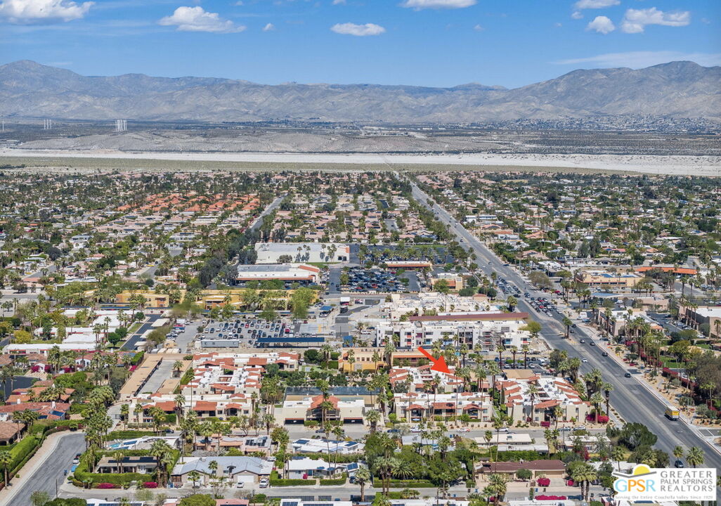 1421 North Sunrise Way, Unit 34 Palm Springs, CA 92262 - Photo 34 of 34 an aerial view of residential building and parking space