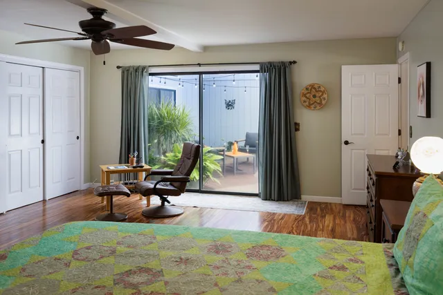 a living room with furniture rug and a window