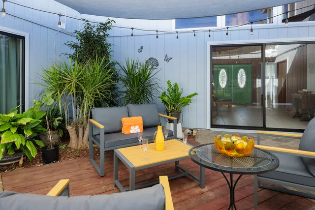 a view of a chairs and table in a patio