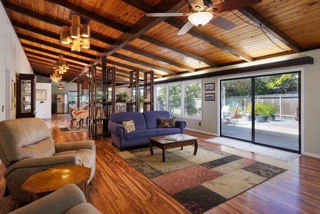 a outdoor living space with furniture and a fireplace