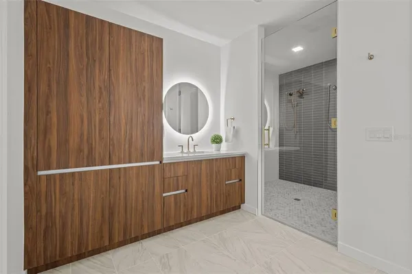 a bathroom with a shower and a sink