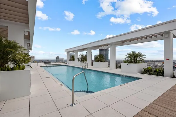 a swimming pool with an outdoor seating